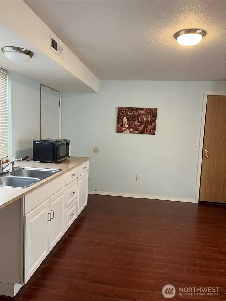 Kitchenette with space for small frig. Microwave stays