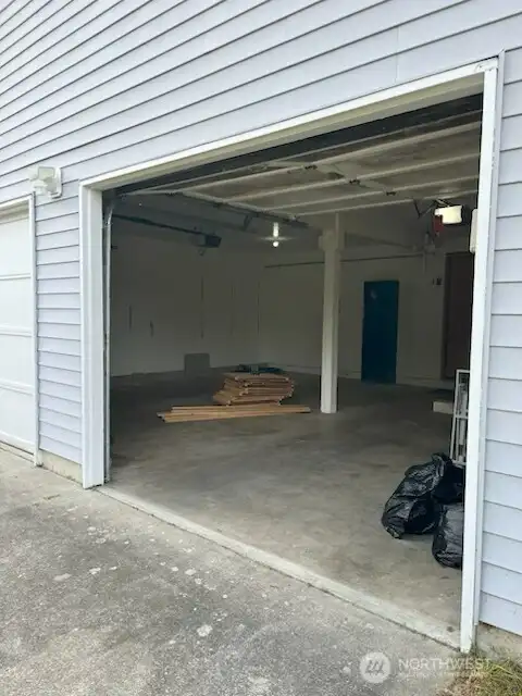 Large 2 car garage with plenty of room for additional storage