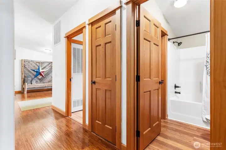 Hallway with 2nd bathroom and laundry room.