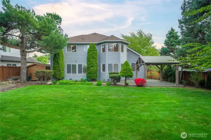 Well maintained yard with space for fun and gardening.