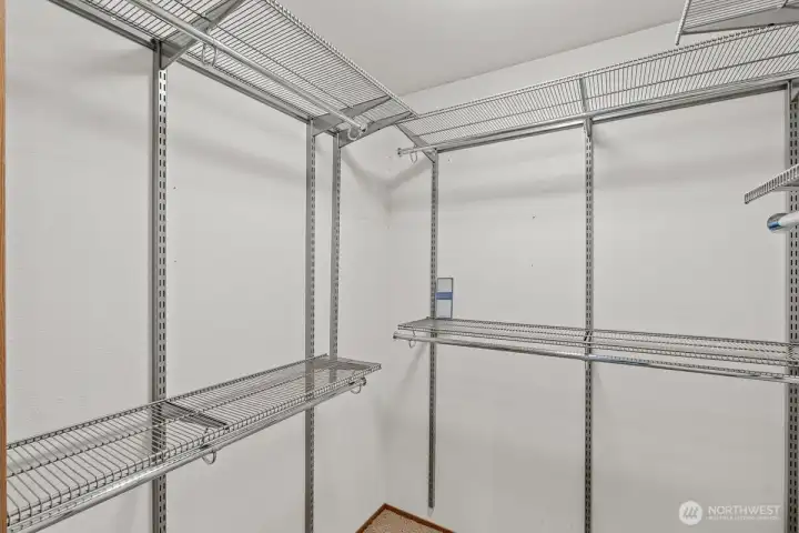 Built in closet organizers in the primary bedroom.