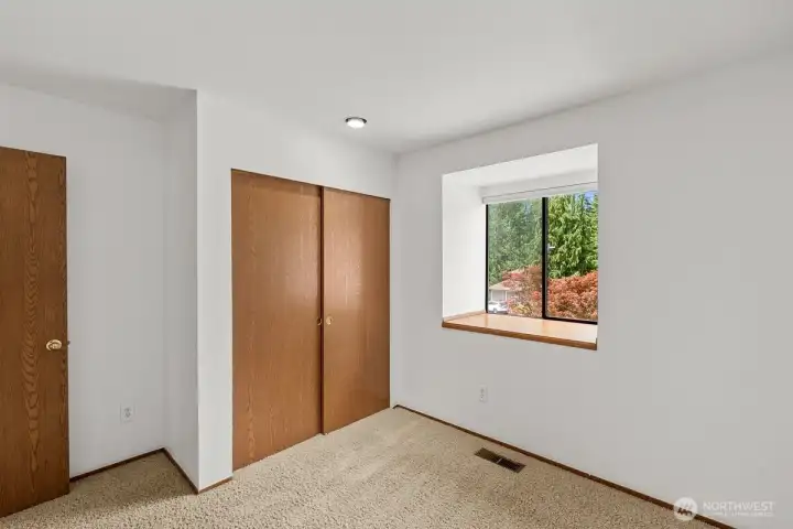 Third bedroom overlooks the front yard space.
