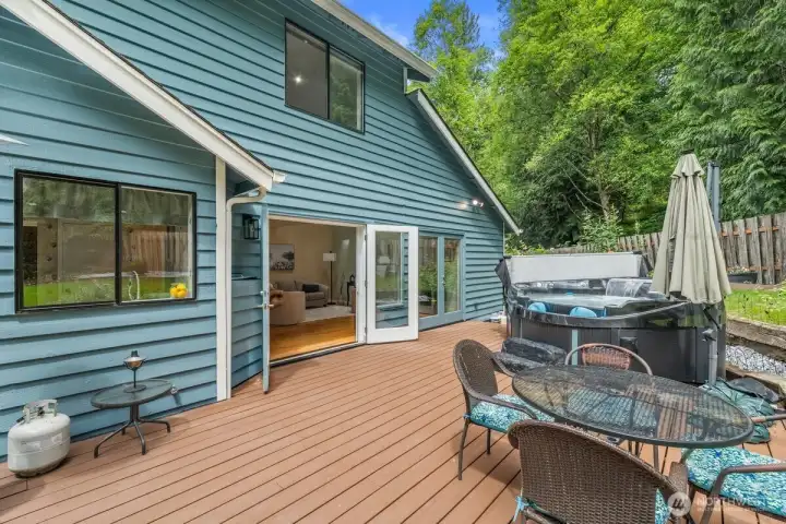 Double french doors off of the family can open wide to allow for access to the deck area - perfect for entertaining.
