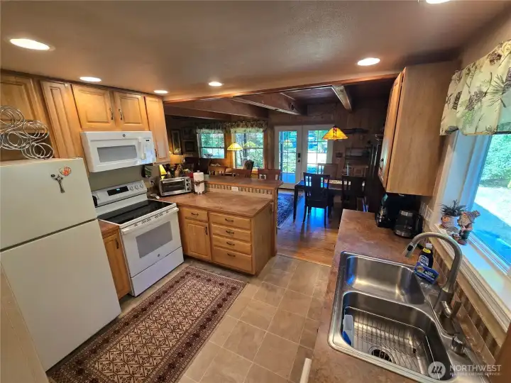 Kitchen opens into the living and dining areas, making for great entertaining.