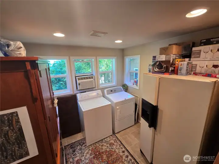 Great sized utility room just off kitchen has door to the outside making for a great mud room on rainy days.