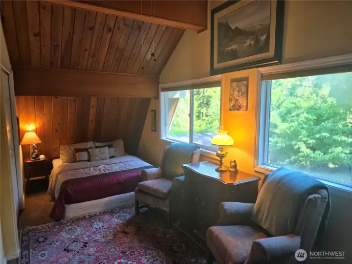 Upper bedroom comfortably fits 2 queen size beds.