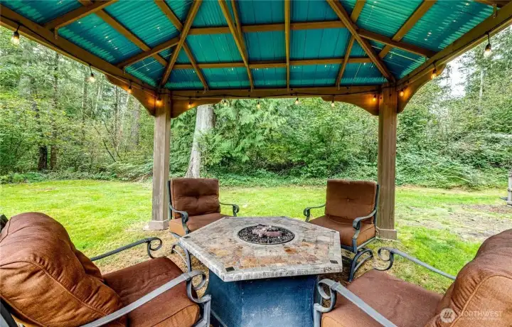 Gazebo, fire table and seating makes for year-round entertainment in all weather conditions.