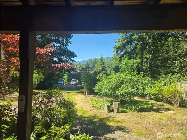 Enjoy viewing the mountain and large front yard from covered front porch and downstairs living space.