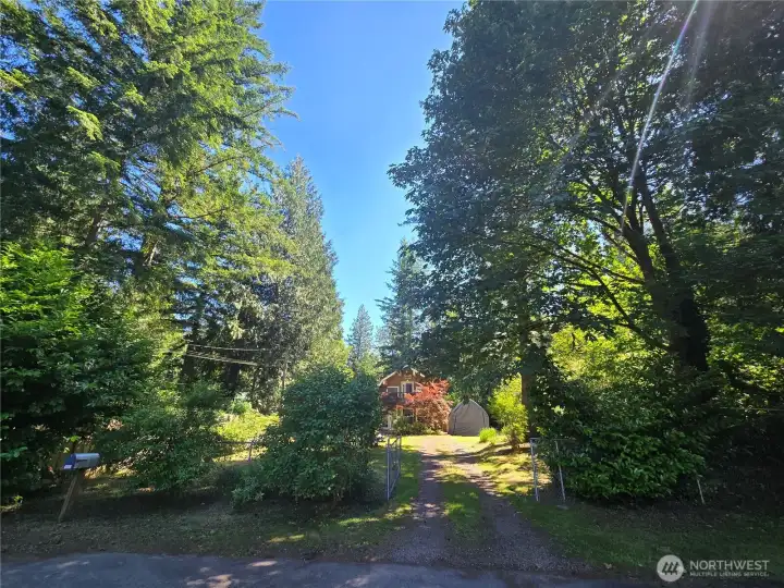 Property is partially fenced and has a rolling gate to close off driveway.