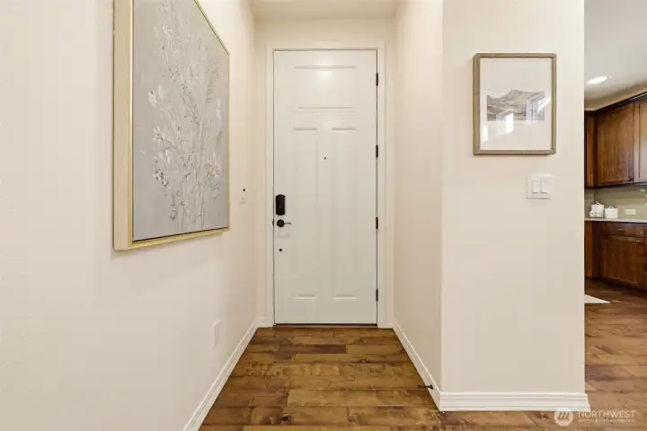 Foyer. Rich hardwood flooring and a designated art wall set a polished tone right from the entrance. Foyer. Rich hardwood flooring and a designated art wall set a polished tone right from the entrance.
