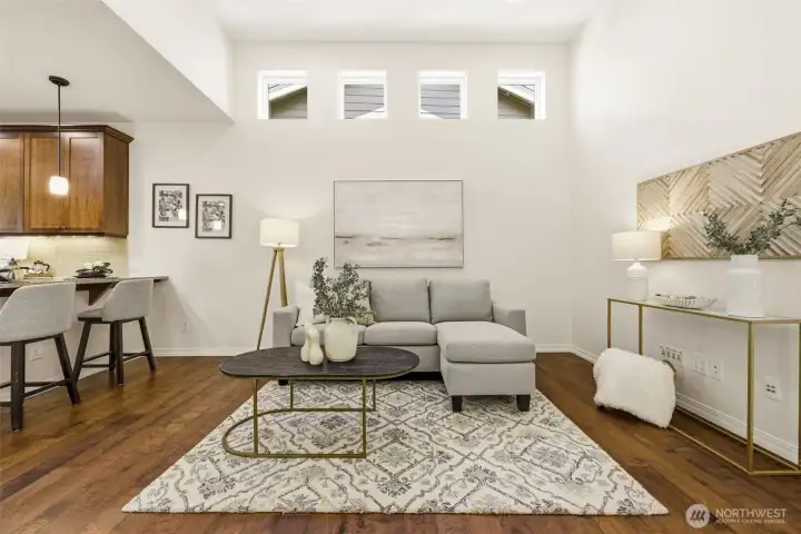 Living Room. Open sightlines connect the living area to the kitchen and dining space beyond, ideal for entertaining. Living Room. Open sightlines connect the living area to the kitchen and dining space beyond, ideal for entertaining.