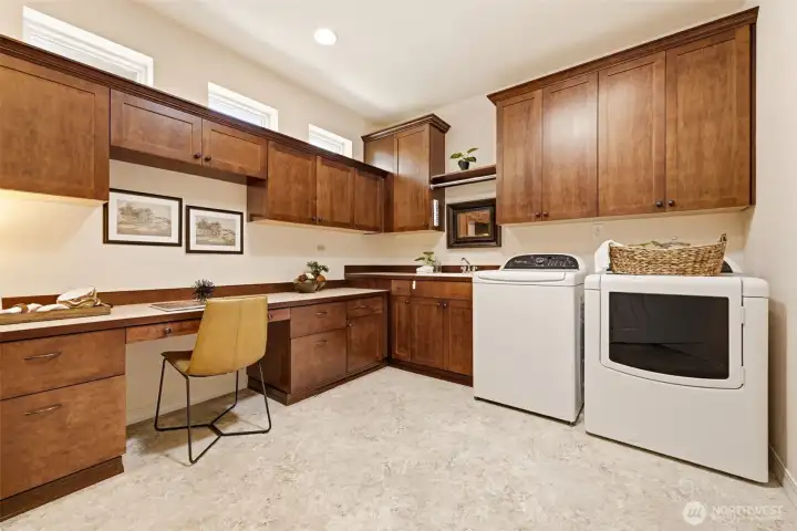 Laundry Room. Abundant cabinetry and counter space offer a functional area for laundry and everyday organization. Laundry Room. Abundant cabinetry and counter space offer a functional area for laundry and everyday organization.