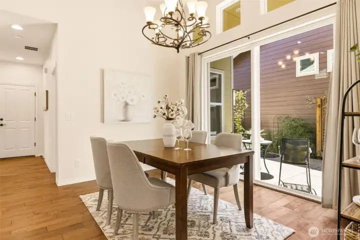 Dining Room. A sliding glass door brings in natural light and opens directly to the outdoor patio. Dining Room. A sliding glass door brings in natural light and opens directly to the outdoor patio.