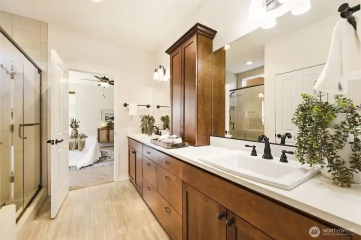 Primary Bathroom. A glass-enclosed shower and dual vanity create a spa-like feel just steps from the bedroom. Primary Bathroom. A glass-enclosed shower and dual vanity create a spa-like feel just steps from the bedroom.
