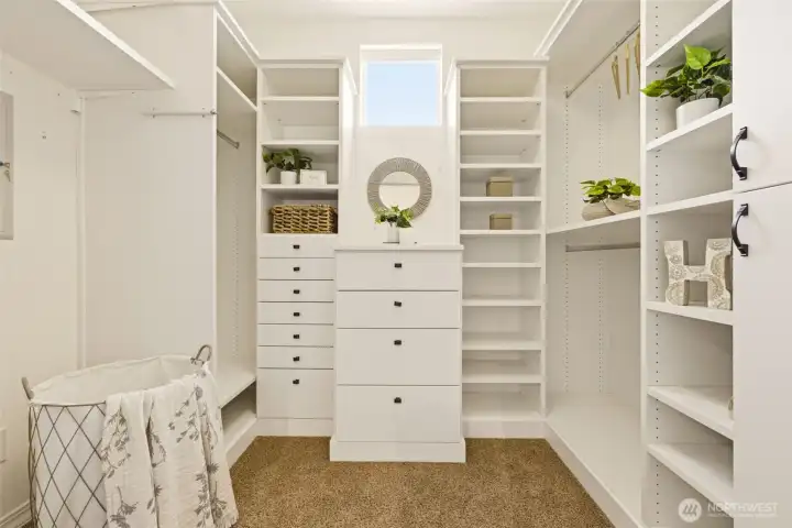 Walk-in Closet. Custom built-in shelving and drawers provide organized storage tailored to fit any wardrobe. Walk-in Closet. Custom built-in shelving and drawers provide organized storage tailored to fit any wardrobe.