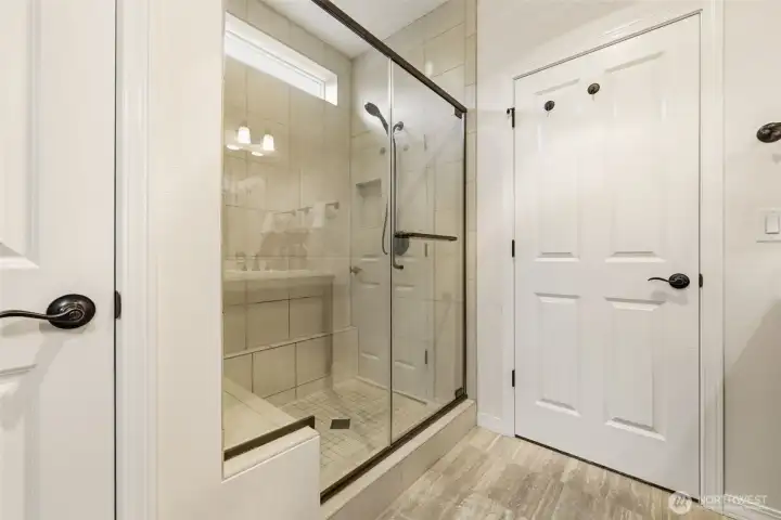 Primary Bathroom. A glass-enclosed tile shower adds a spa-like touch to the space. Primary Bathroom. A glass-enclosed tile shower adds a spa-like touch to the space.