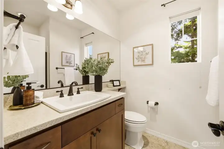 Bathroom. A granite-topped vanity and natural light create a fresh, welcoming feel. Bathroom. A granite-topped vanity and natural light create a fresh, welcoming feel.