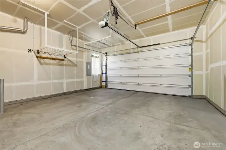 Garage. Overhead storage racks maximize space while leaving room for parking and everyday gear. Garage. Overhead storage racks maximize space while leaving room for parking and everyday gear.