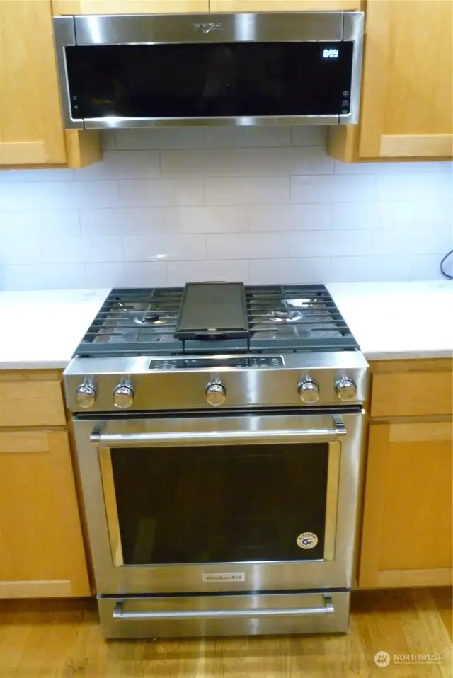 SS kitchen stove and whirlpool Microwave