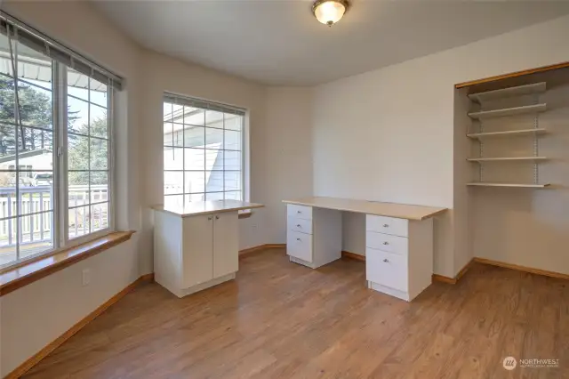 This is the first bedroom.  Currently set up as an office, but can easily be whatever you need it to be!  Craft room?  Music room?  Bedroom?  It's a spacious room overlooking the front lawn.