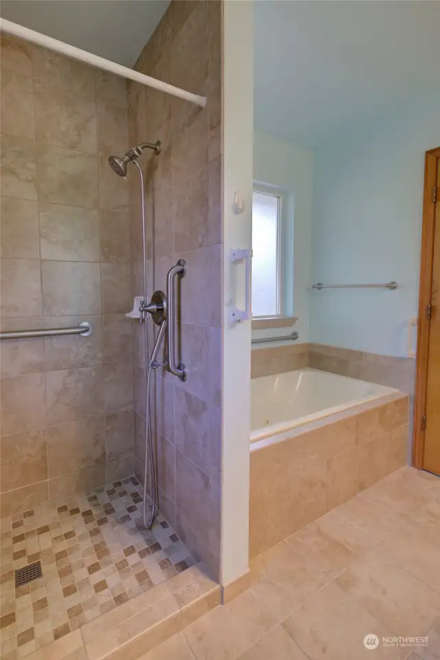 Primary bath also has a lovely, step-in tiled shower, and jetted tub.