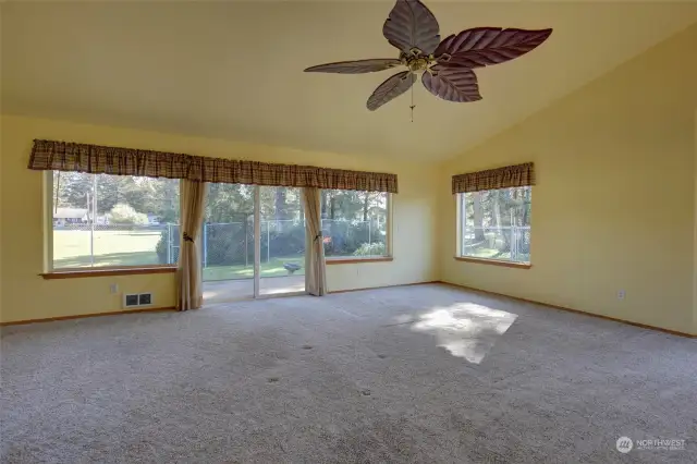 Enjoy the morning sun in the living room, along with the huge windows and vaulted ceilings.