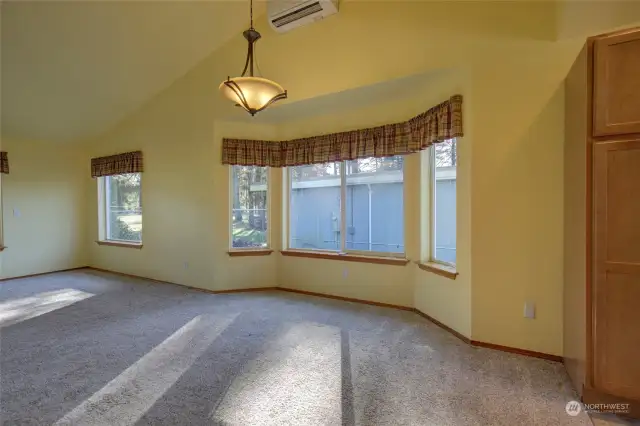 Dining area has plenty of room for seating and entertaining, as well as more big windows to enjoy the golf course views.