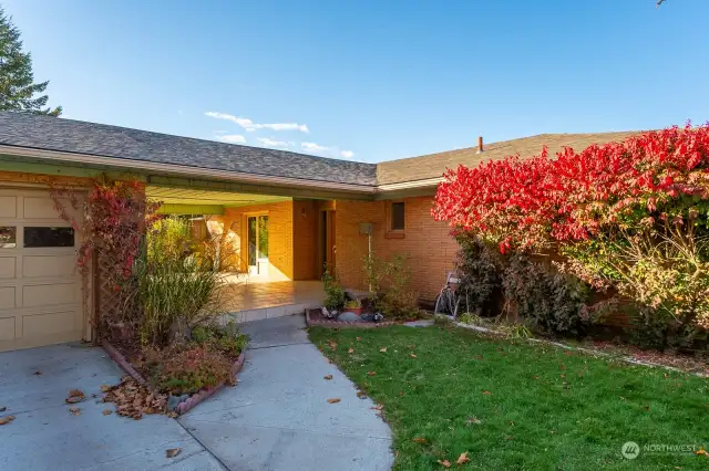 Gorgeous entry with mature landscaping.