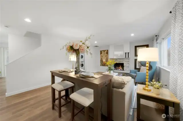 From the entry, you are greeted with a warm environment of nearly 300 ft²  in the Living / Dining combined area. The wrap-around layout flows to the Kitchen w/eating space on the left and the main level half-bath and laundry.