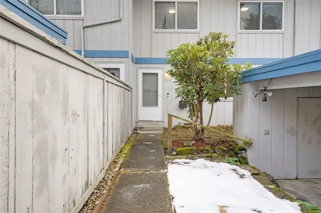 Entrance to the townhome is right next to your carport with storage area.