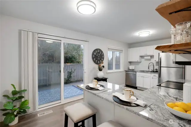 The large Kitchen w/eating space provides a slider access to secluded back deck.