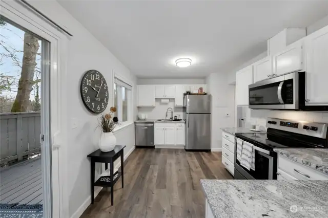 The Kitchen has had upgrades with granite counter tops, LVP flooring, and stainless-steel appliances.