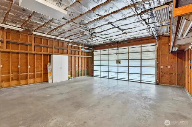 Spacious attached 2-car garage with high ceilings