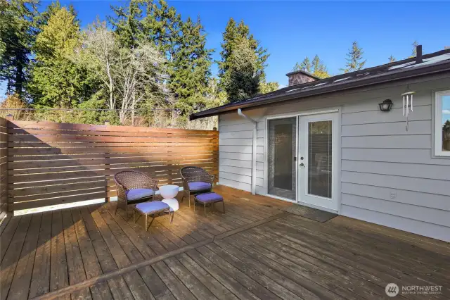 Private deck adjacent to the kitchen and dining room