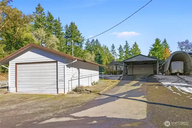 Additional garage (left), carport and 2-car garage (middle), and RV storage right)