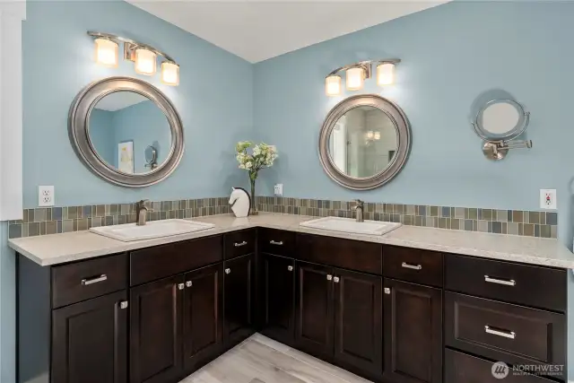 Enjoy a large dual vanity with ample storage