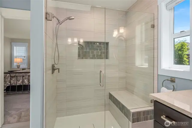 The walk-in glass shower is massive!
