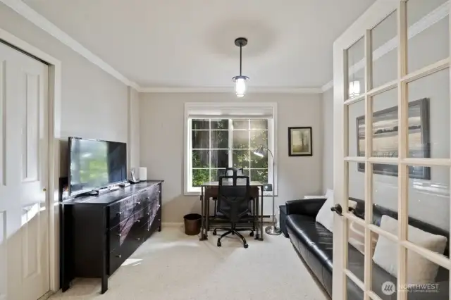French doors create a beautiful flow into this flexible bedroom or office space