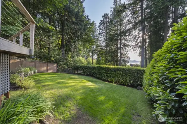 Mature vegetation provides privacy and a lush, green backdrop