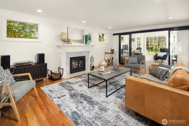 Grand herringbone marble fireplace serves an anchor in this fabulous formal living room.