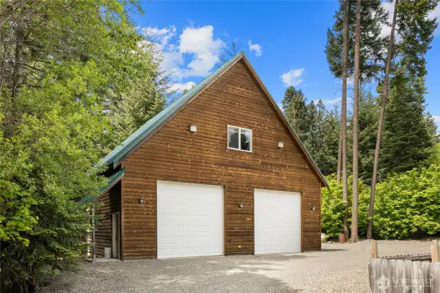 Garage accomodates 4 cars, shop.