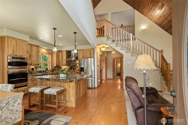 Great room concept.  Kitchen island, hardwood floors.