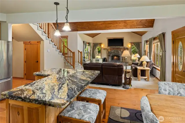 Cozy firelplace, kitchen island with marble top.