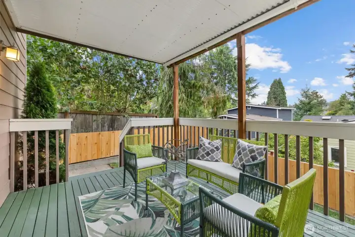 south facing covered deck opens out to the yard