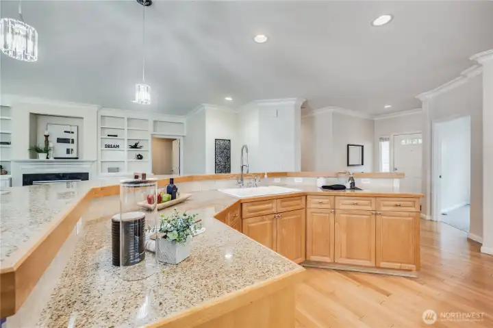This generous kitchen island offers tons of counterspace for food prep and entertaining, as well as housing the sink and dishwasher.