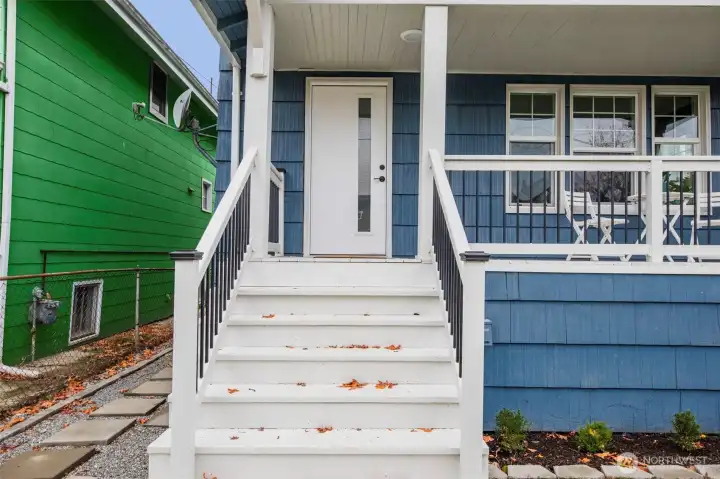 You are immediately greeted with a freshly painted exterior stairwell that leads you home.