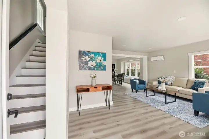 Beautiful lvp flooring throughout greets you as you enter the open concept home with a large living space.