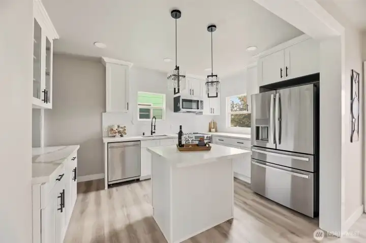 This home features a completely redone kitchen with all-new cabinets, countertops, and modern finishes.