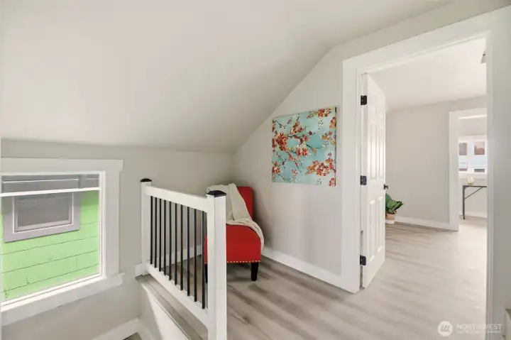 As you head upstairs you have a perfect little reading nook or desk area for work.