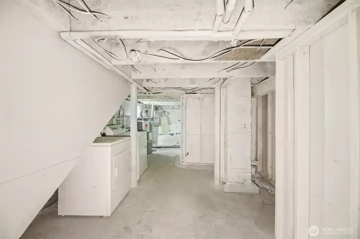 As you head to the basement, the first door to the left is the laundry along with a large storage area.